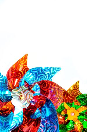 Children's colorful toy pinwheel on white backgroundの写真素材