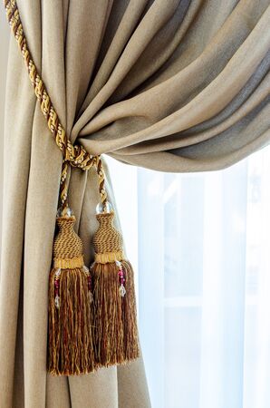 Dual tassels on curtain at main windowの写真素材