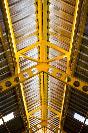 Inside view of tin roof and beamsの写真素材