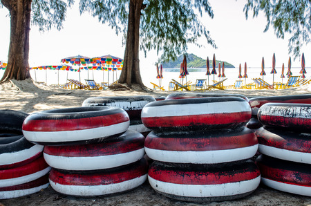Floating tyres waiting for rent at the beach Thailandの写真素材