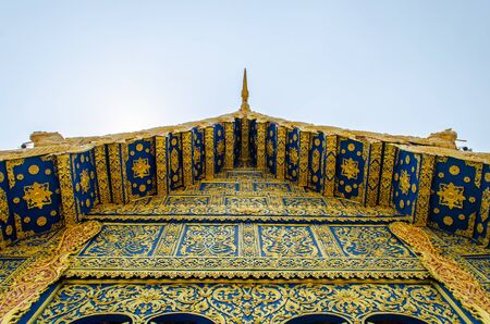 Blue and gold detail on Temple Roofの写真素材