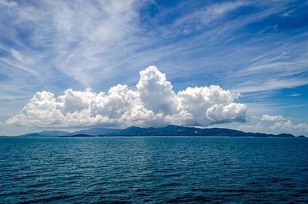 View from boat across ocean to Pha-Ngan islandの写真素材