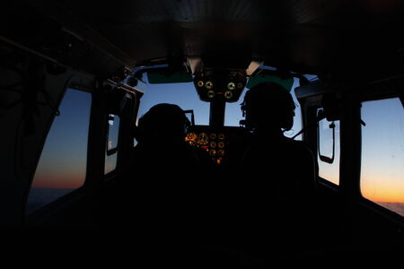 Two pilots navigating the plane