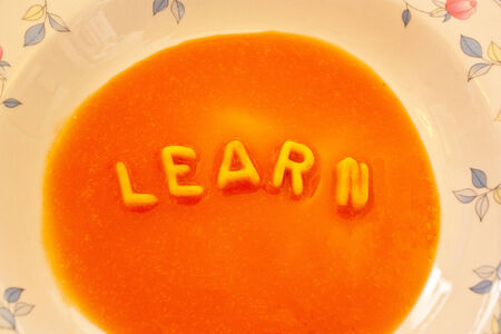 Close up of a whole cake with learn wordの写真素材