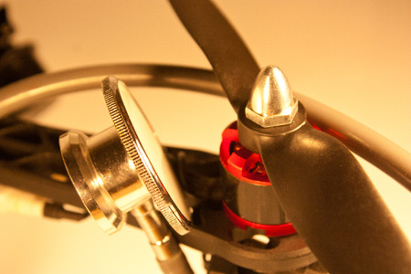 Stethoscope head beside an unmanned propeller