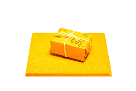 Small parcel on a small wooden slabの写真素材