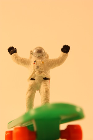 A  astronaut having fun, skateboarding.の写真素材