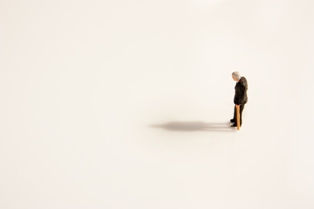 An old man looks down after the lost life of his partner.の写真素材