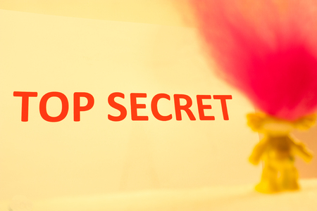 A troll looks on to the words 'Top Secret'の写真素材