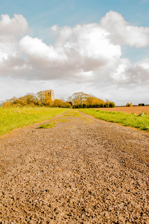A long path / road leading up to St.Botoloph's Church, Skidbrooke in England UK.の写真素材
