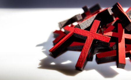 Many crucifix crosses together against a blank background.の写真素材