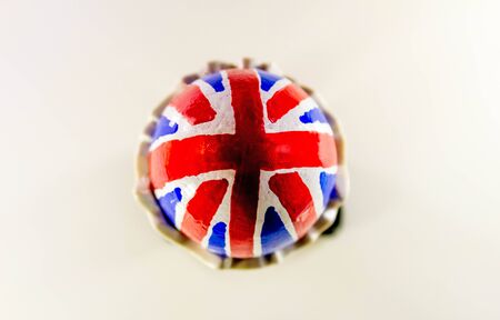 A British flag egg in a novelty egg cup, with legs.の写真素材