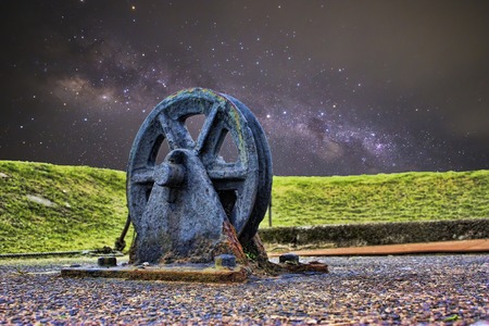 June 27, 2011 â Belfast, Northern Ireland, United Kingdom. A close up view from the ground of a large wheel that has been left in place for decades. It once held the ropes of the Titanic that was docked in Belfast.の写真素材