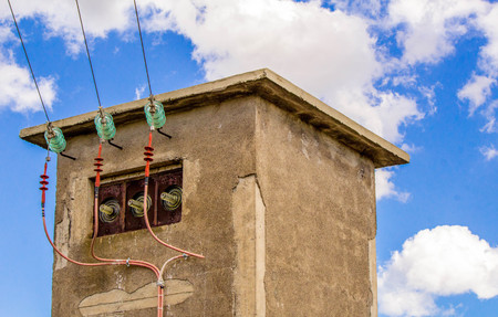 A remote energy supply tower in the countryside of Sicily, Italy.の写真素材