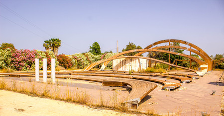 A set of wooden arch beams fallen down from an old drive through cinema that once sat on the island of Sicily, Italy.の写真素材
