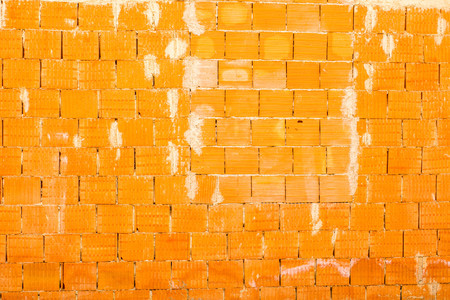 A wall of square orange bricksの写真素材