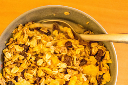 A view from above a bowl of muesli cereal.