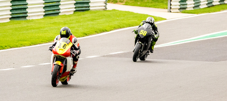 Motorbikes race around the famous track at Cadwell Park, in England, UK.のeditorial素材