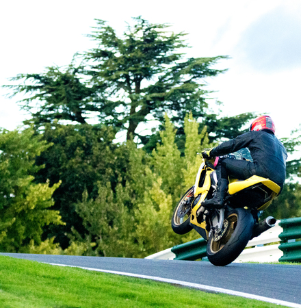 Motorbikes race around the famous track at Cadwell Park, in England, UK.