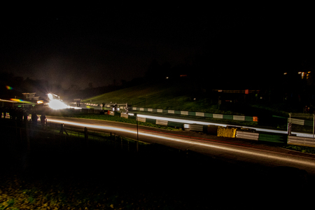 A rally undertaken on a racetrack, carried out at night / dusk.の写真素材
