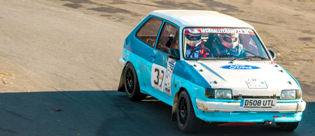 18th November 2018 - Cadwell Park, Lincolnshire, United Kingdom. Competitors race around a tarmac racetrack in their modified and powered rally cars.のeditorial素材