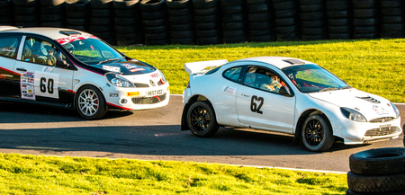 18th November 2018 - Cadwell Park, Lincolnshire, United Kingdom. Competitors race around a tarmac racetrack in their modified and powered rally cars.のeditorial素材