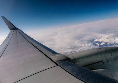 A passenger airline view across the awesome blue skies, during Autumn.
