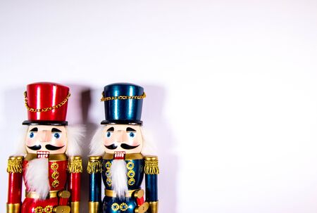 Two colourful Christmas Nutcracker decoration statues on a white background.の写真素材