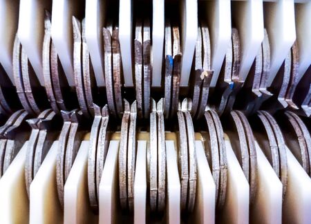 A closeup view of a shredder's teeth, from underneath.