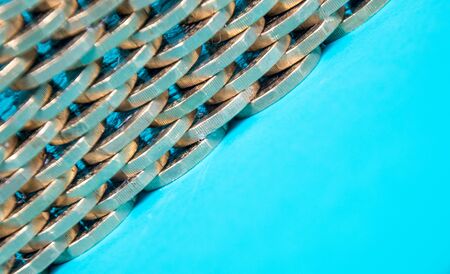 A stack of Pound Coins on a bright blue background.の写真素材