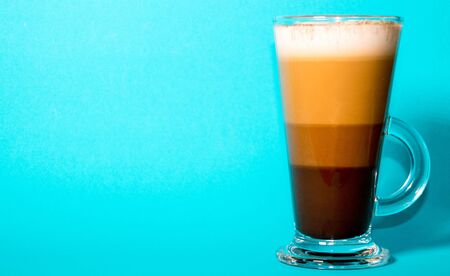 A specially made festive coffee, against a bright blue background.