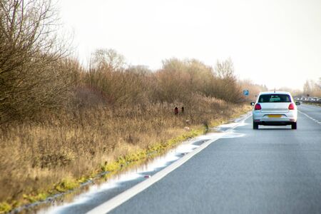 A typical view along one of the thousands of roads that network the United Kingdom for pleasure or business.の写真素材
