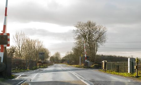 An empty and open level crossing, one of thousands found across the United Kingdom.の写真素材