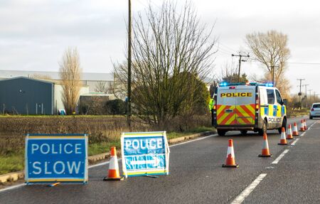 Police have coned off a lane of a busy main road, in the United Kingdom, to prevent any further accident.の写真素材