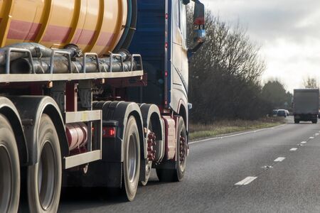 A large HGV travels across country to deliver or collect goods for the next business location.