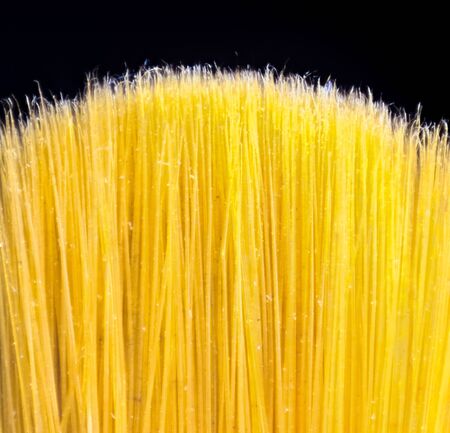 An ultra closeup view of a paint brush head, showing all the bristles.の写真素材