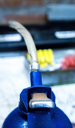 An oil can typically used to lubricate metal parts from rubbing together.