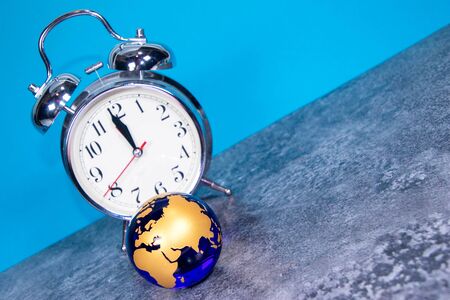 A large analogue clock counts down to a global event or depicts time running out.