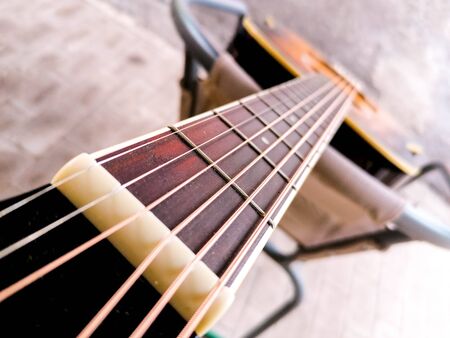 An acoustic guitar view from the top alone the strings.の写真素材