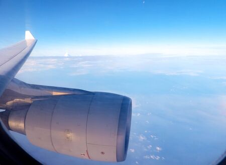 A passenger view, onboard and airline, looking out of the window.
