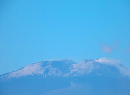 One of the most active volcanoes in the world seen here smoking after a large eruption. This is Mount Etna, located in Sicily, Italy.の写真素材