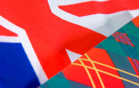 The Union Jack flag inside tartan Christmas wrapping paper.