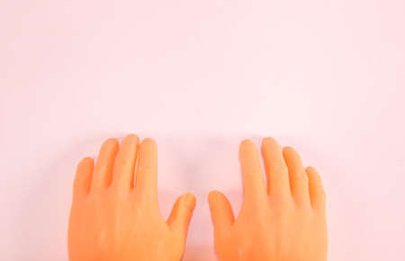 Human adult hands on a white background / desk.