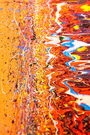 Paint that has piled and piled creating a nice colorful pattern.の写真素材