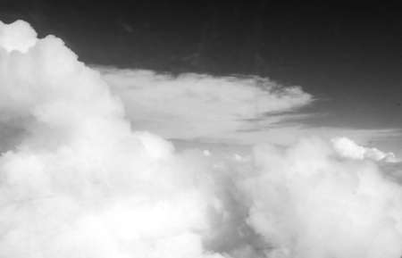 A view from high altitude just above the clouds covering the earth's surface.
