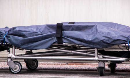 A mortuary stretcher left sat outside a mobile scanning unit in the United Kingdom. The mobile...