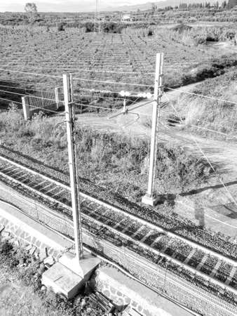 A view of one section of railway network that stretches across the land of Sicily, Italy, taking commuters quickly across the vast lands from one side of the island to the other.の写真素材
