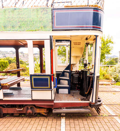 July 30, 2021 : Colyton, England, United Kingdom. A vintage tramway for tourists and locals from all around to come and enjoy. This view of just one of the tram train stations, at Colyton to pick up and drop off passengers.のeditorial素材