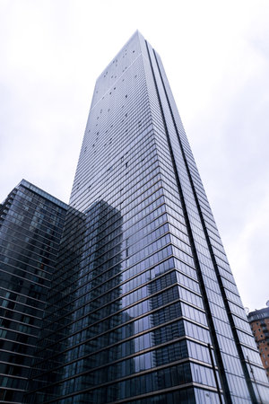 A ground perspective of some high rise buildings in the middle of a large city, in this case London,...