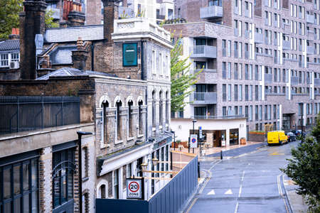 A ground perspective of some high rise buildings in the middle of a large city, in this case London,...